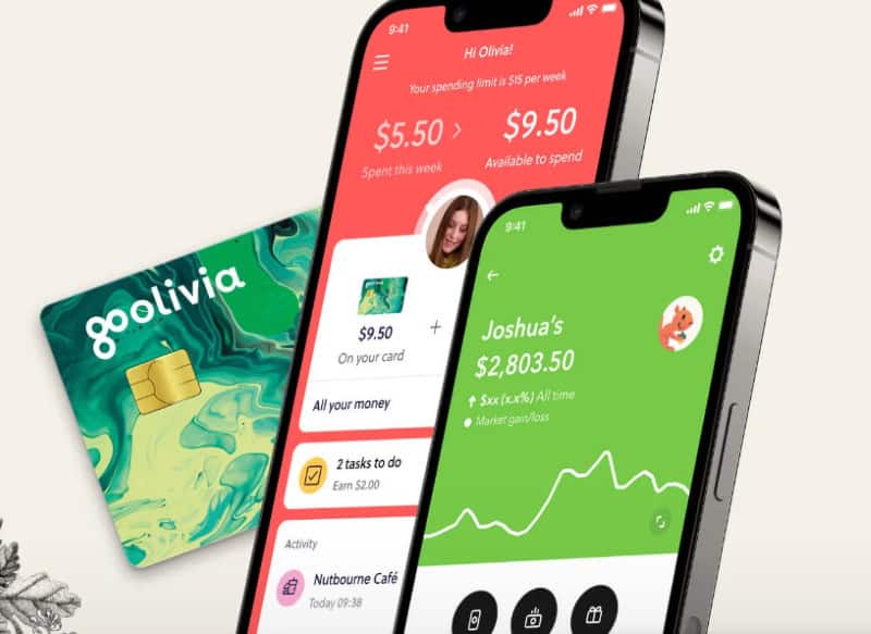 The Acorns investing app on a smartphone and an Acorns debit card. 