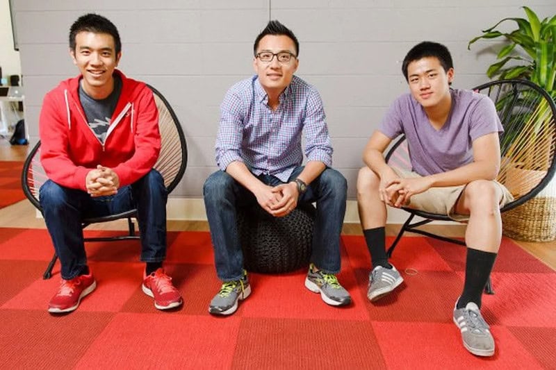 Stanley Tang, Tony Xu, and Andy Fang sitting next to each other