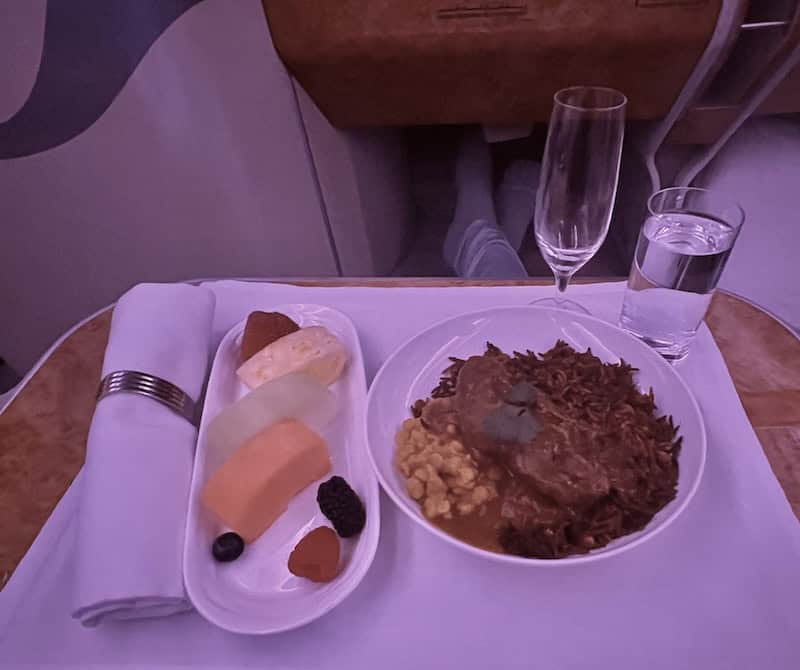 Lamb dinner served to Emirates business class passengers onboard a flight from New York to Milan. 