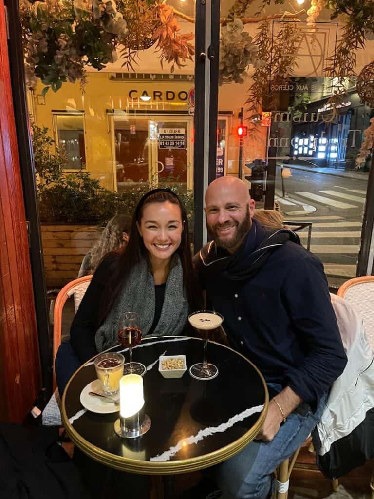 Couple getting drinks in the Latin Quarter of Paris. 