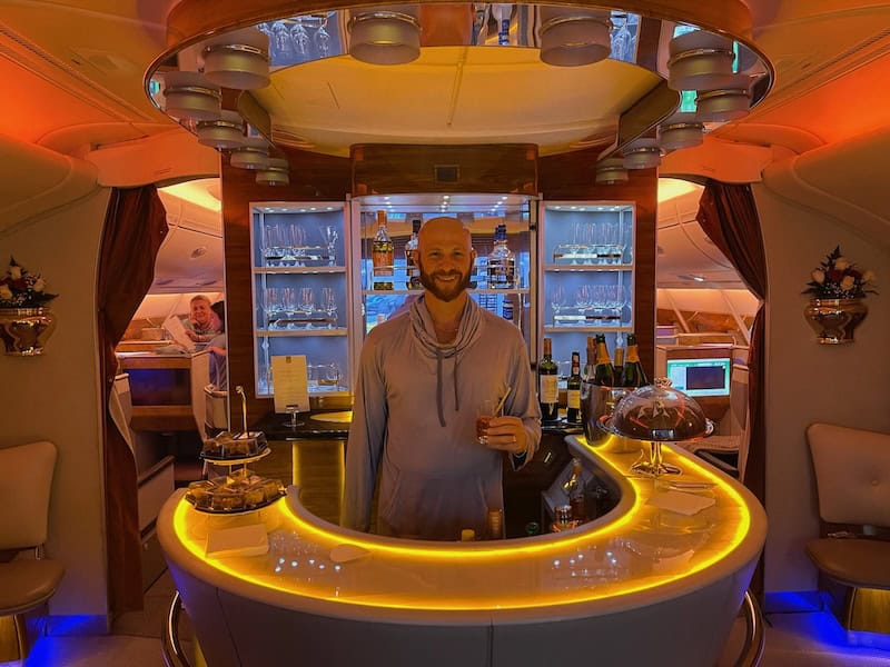 Scott standing behind the bar onboard the Emirates airbus A380. 